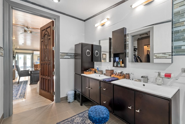 bathroom with ornamental molding and vanity