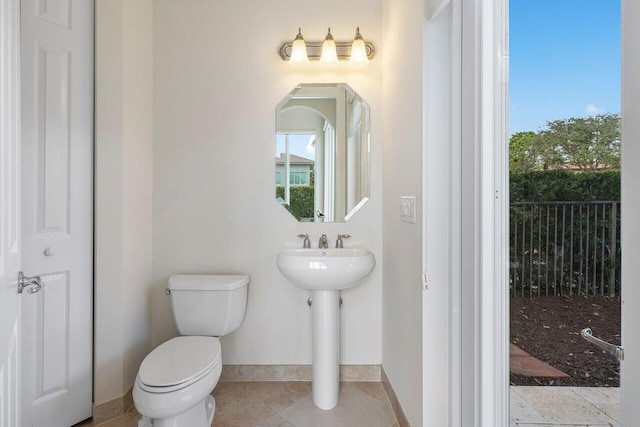 bathroom featuring sink and toilet