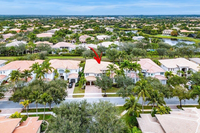 birds eye view of property featuring a water view