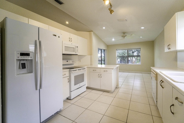 kitchen featuring white cabinetry, sink, light tile patterned floors, kitchen peninsula, and white appliances