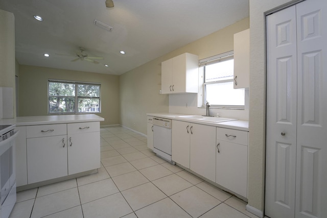 kitchen with white cabinetry, sink, and white appliances