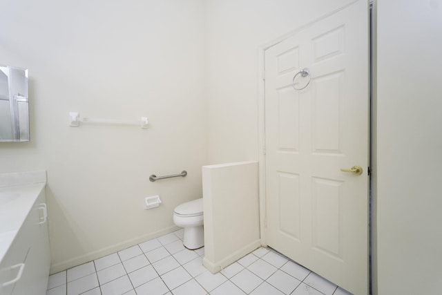 bathroom with tile patterned flooring and toilet