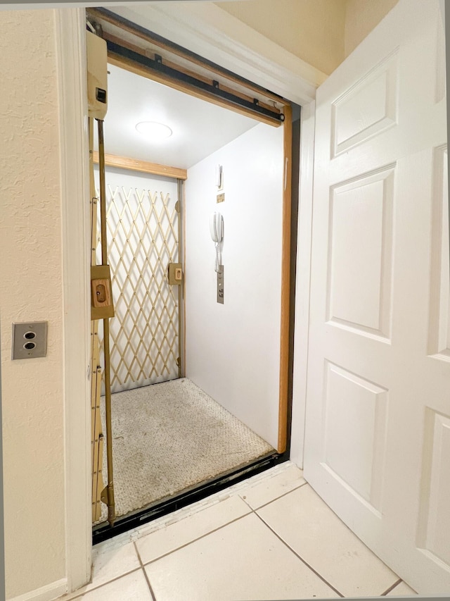 bathroom with tile patterned flooring