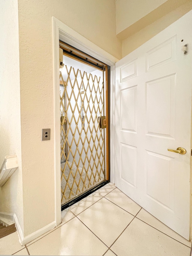 interior space featuring light tile patterned floors