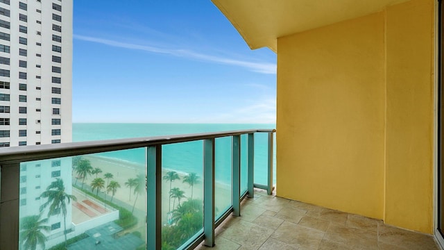 balcony featuring a water view