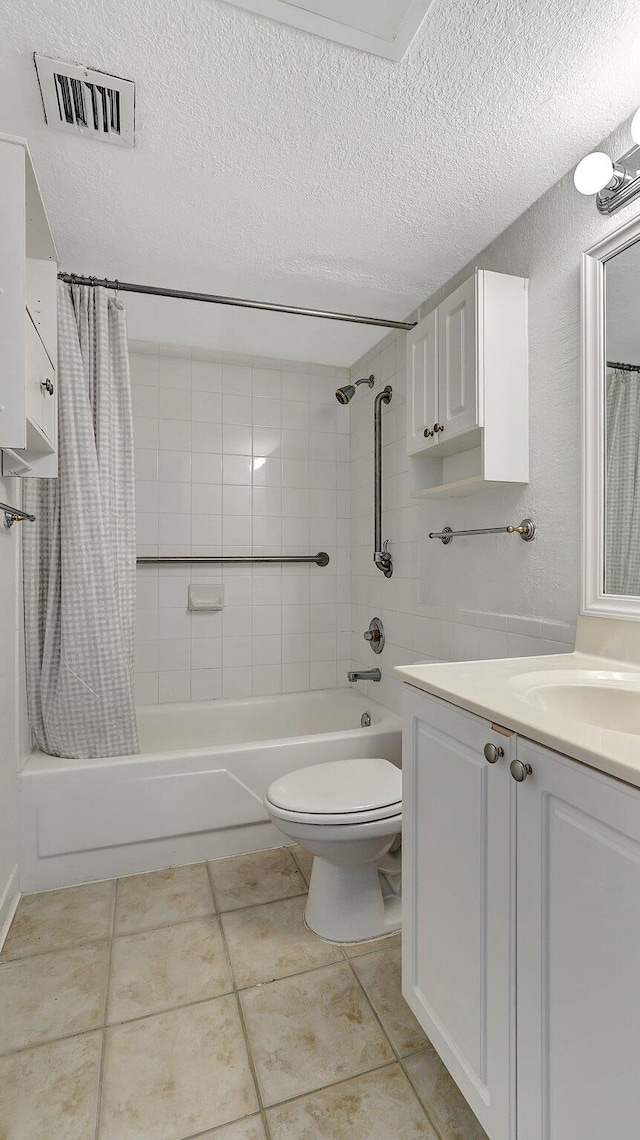 full bath with a textured ceiling, toilet, vanity, visible vents, and shower / bath combo with shower curtain