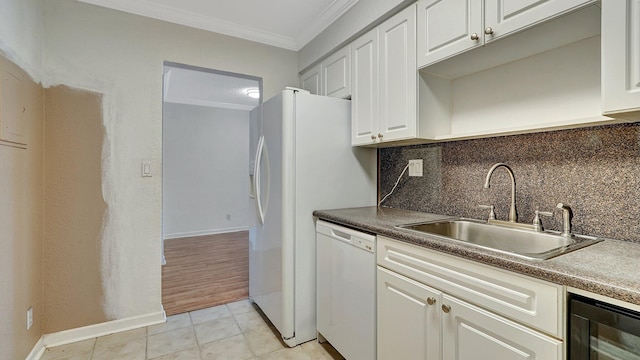 kitchen with dishwasher, sink, crown molding, white cabinets, and beverage cooler