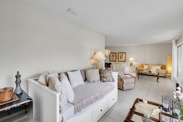 tiled living room with a textured ceiling