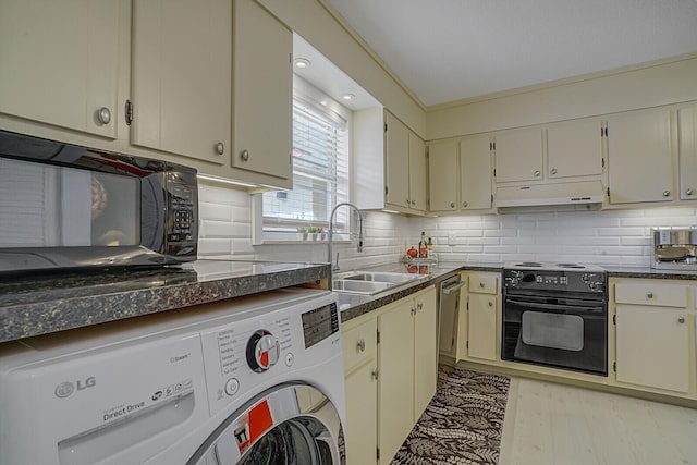 kitchen featuring range with electric cooktop, tasteful backsplash, washer / clothes dryer, cream cabinets, and sink