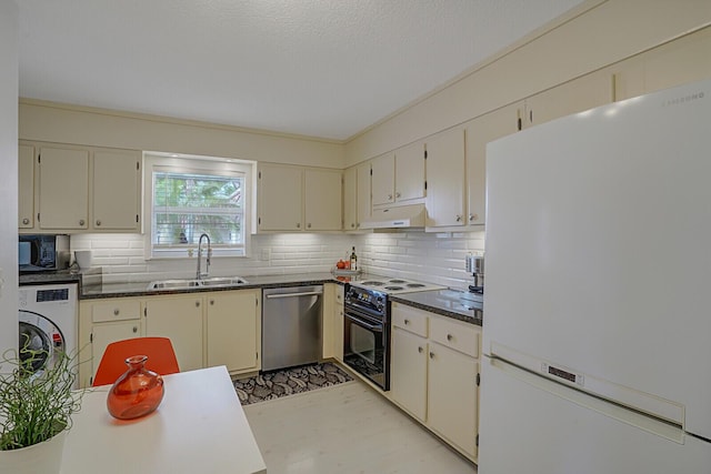 kitchen featuring electric range oven, dishwasher, white fridge, sink, and cream cabinets