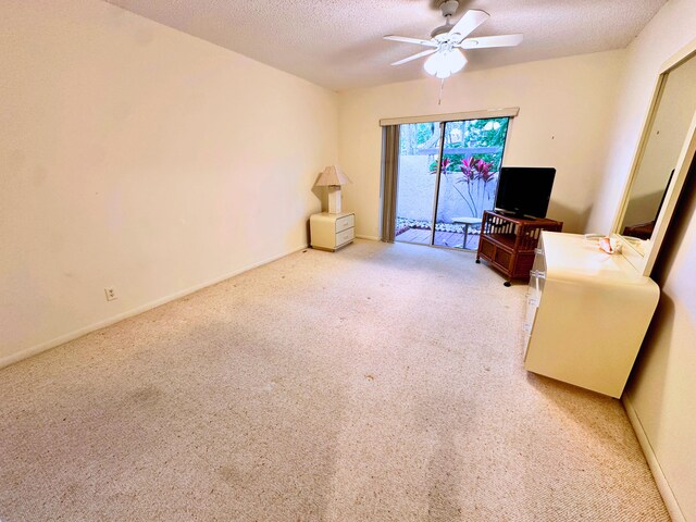 bedroom featuring ceiling fan, a textured ceiling, and light tile patterned flooring