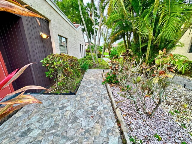 view of property exterior featuring a lawn