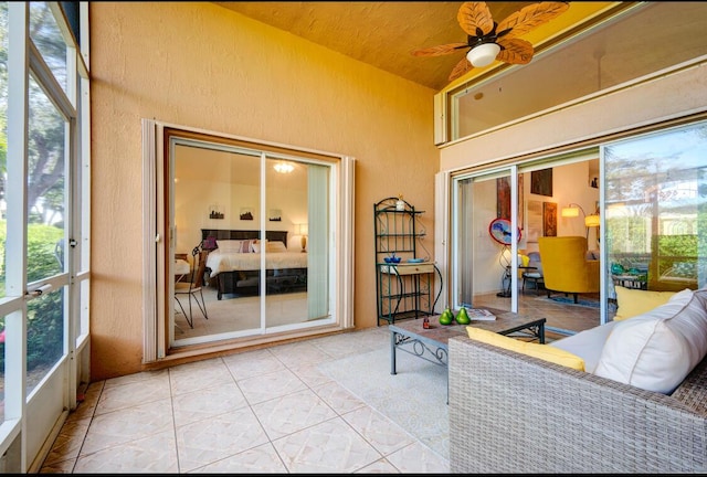 sunroom / solarium with vaulted ceiling and ceiling fan