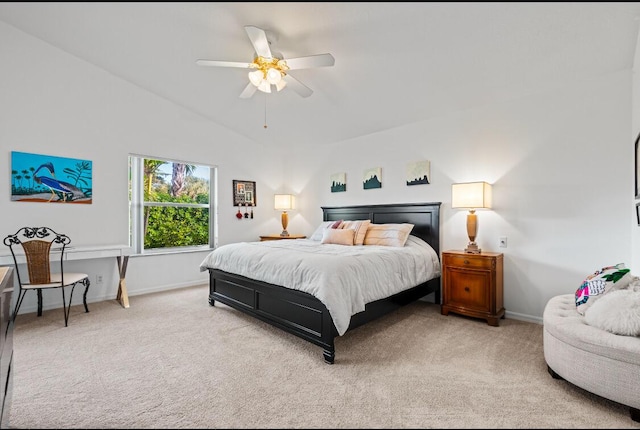 bedroom featuring vaulted ceiling, light colored carpet, and ceiling fan