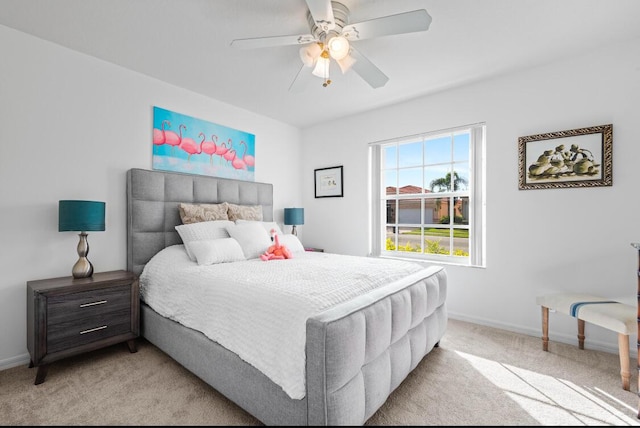 bedroom with light colored carpet and ceiling fan