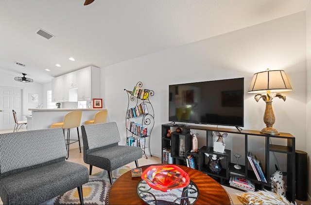 living room with ceiling fan