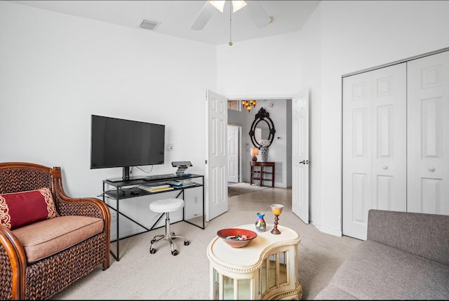 carpeted home office with ceiling fan