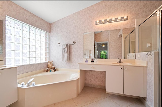 bathroom with independent shower and bath, vanity, and tile patterned floors