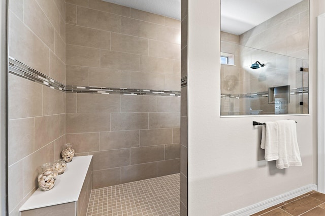 bathroom with tiled shower