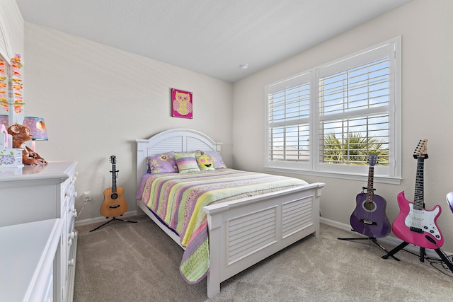 bedroom featuring light colored carpet