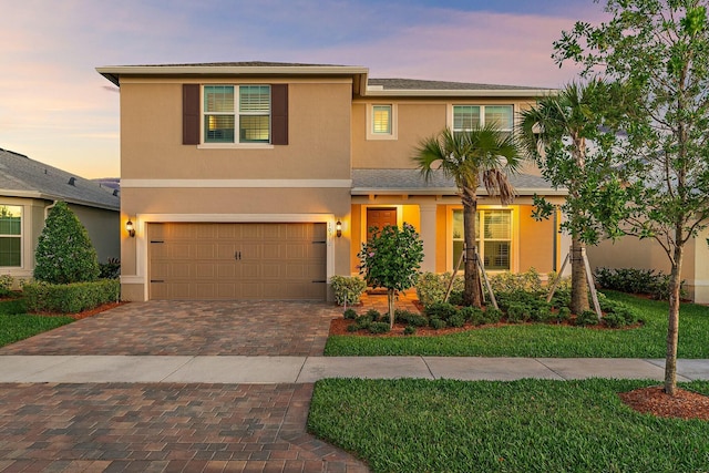 view of front of property with a garage