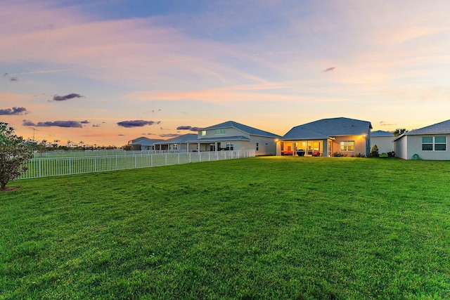 view of yard at dusk