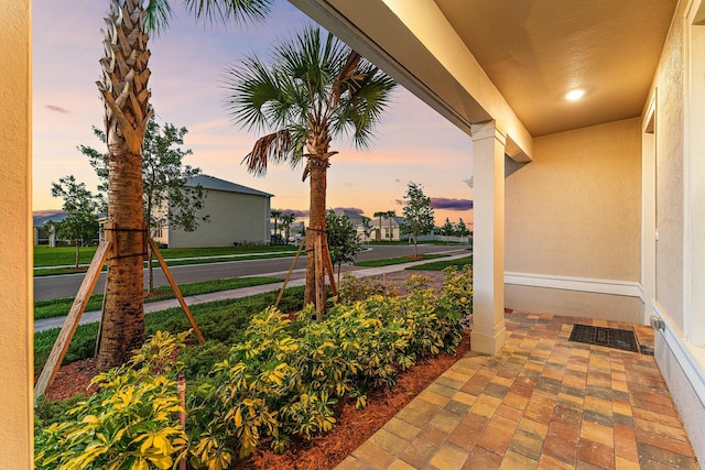 view of patio terrace at dusk