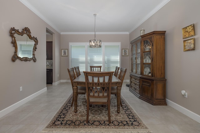 dining room featuring ornamental molding, an inviting chandelier, and light tile patterned flooring