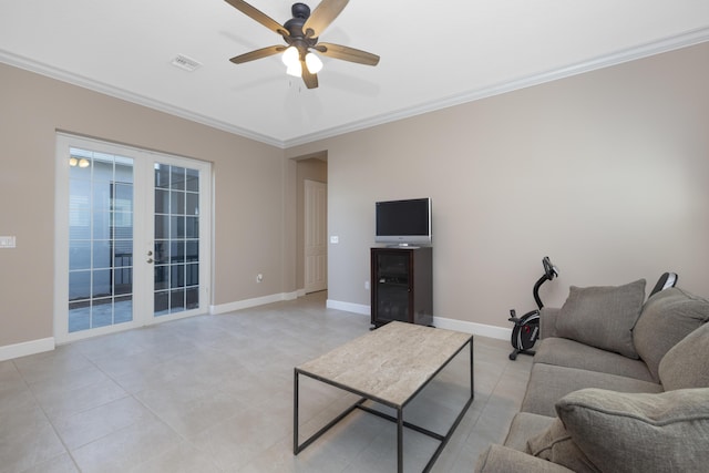 tiled living room with ceiling fan, french doors, and crown molding