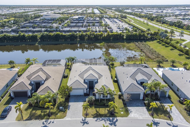 birds eye view of property with a water view