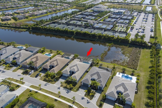 birds eye view of property featuring a water view