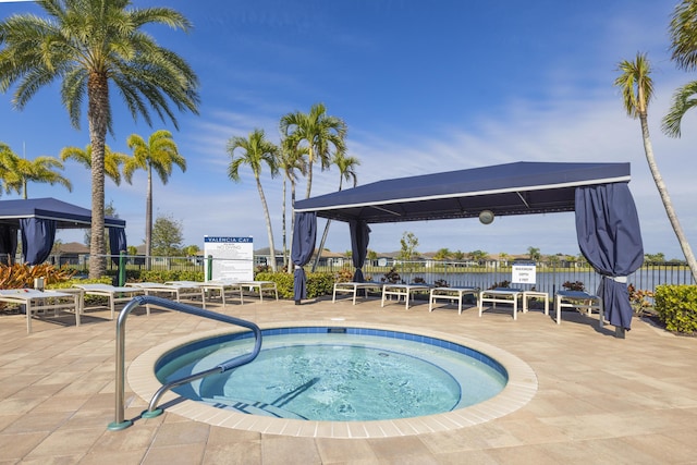 view of pool with a gazebo, a hot tub, and a patio