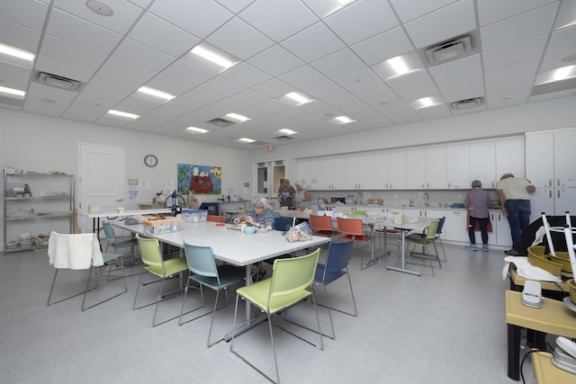 dining area with a drop ceiling