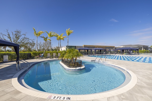 view of swimming pool featuring a gazebo