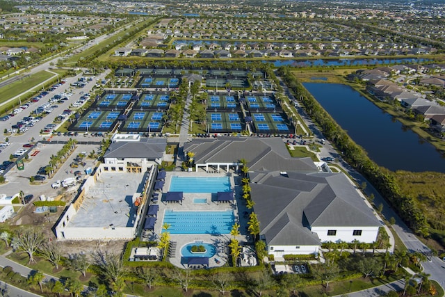 birds eye view of property with a water view