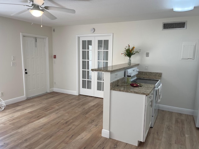 kitchen featuring white cabinetry, french doors, light hardwood / wood-style floors, kitchen peninsula, and electric range