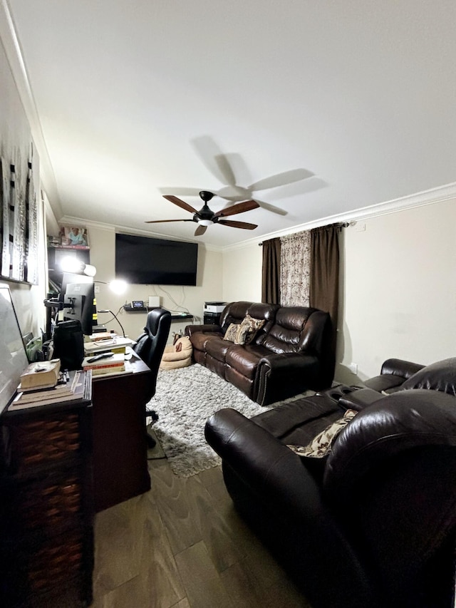 living room with crown molding, dark wood-type flooring, and ceiling fan