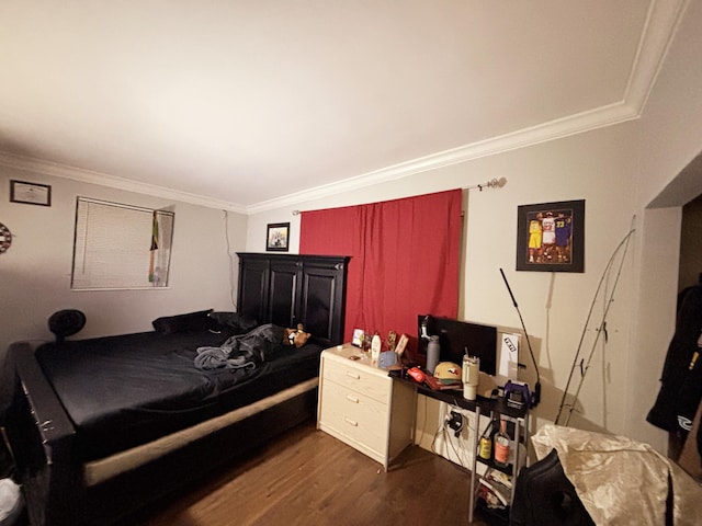 bedroom featuring dark wood-type flooring and crown molding