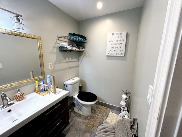 bathroom with vanity and toilet