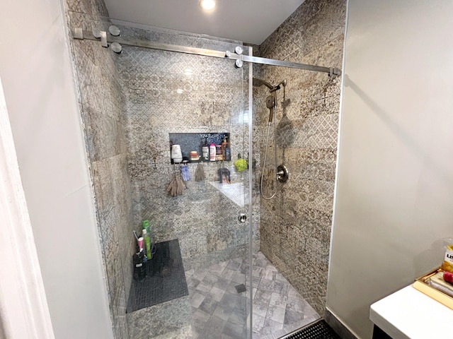 bathroom featuring an enclosed shower