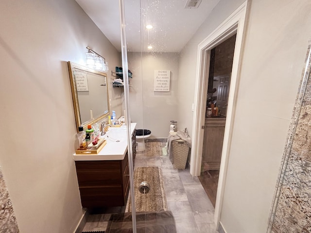 bathroom with vanity and toilet