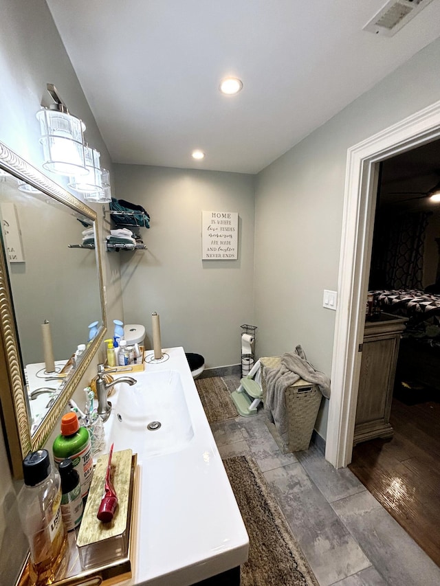 bathroom featuring vanity and hardwood / wood-style flooring