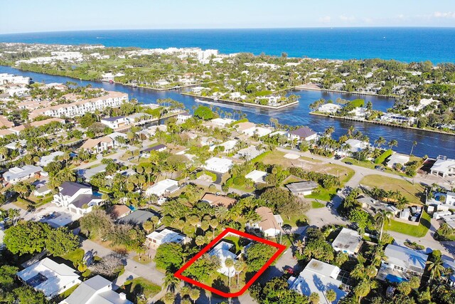 birds eye view of property featuring a water view and a residential view