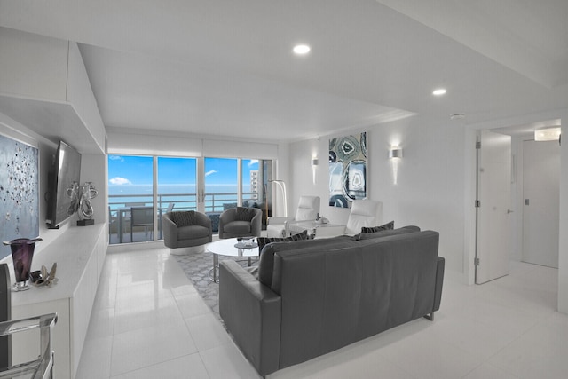 living room featuring light tile patterned floors and floor to ceiling windows