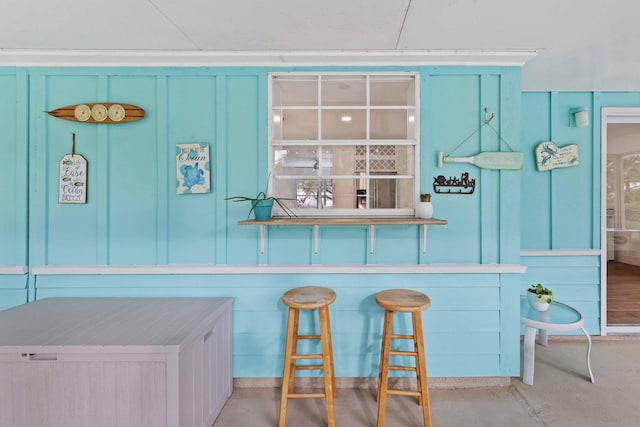 kitchen featuring blue cabinets and a kitchen breakfast bar