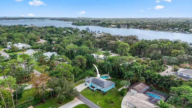 birds eye view of property with a water view