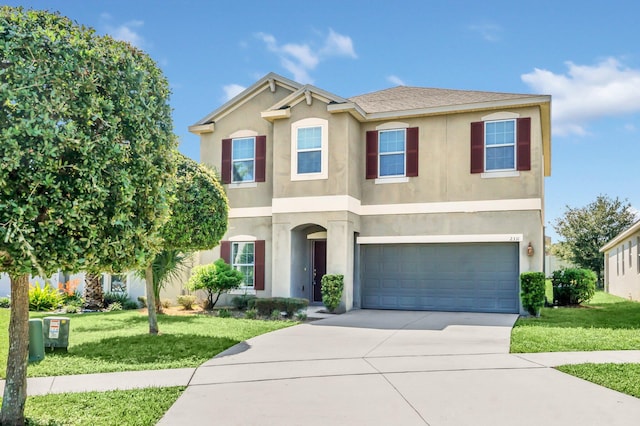 view of front facade with a front yard and a garage