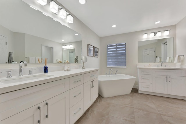 bathroom featuring vanity and a bathing tub