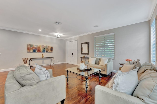 living room with dark hardwood / wood-style flooring and crown molding