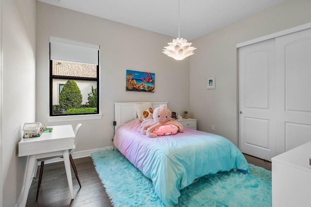 bedroom featuring a closet and hardwood / wood-style flooring